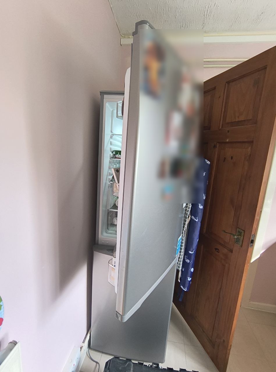 Before: the fridge-freezer door swung out into the room across the doorway, with the inside harder to get at